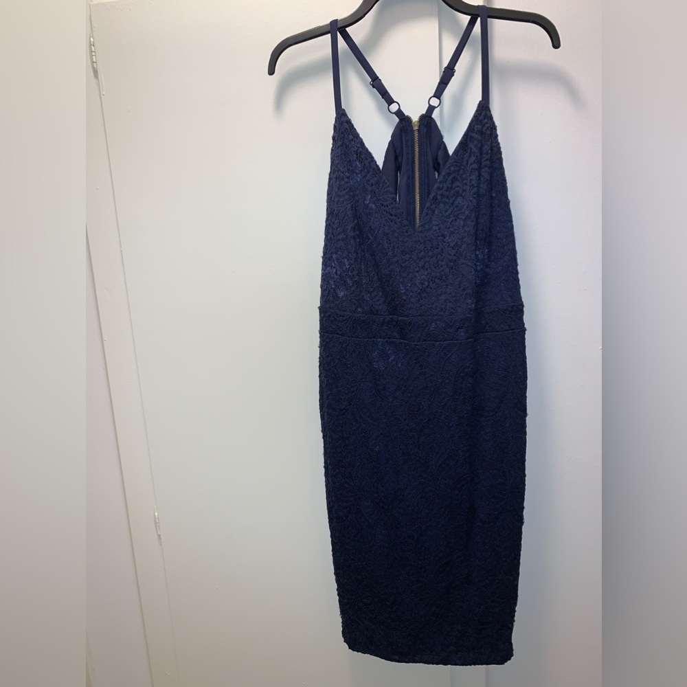Navy blue lace cocktail dress. Sleeveless, semi sheer racerback.